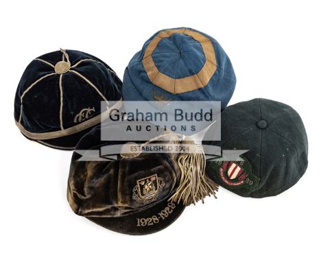 A collection of four miscellaneous sporting caps dating between 1912 and 1939,the first black cap with a monogram possibly re