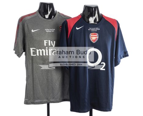 Two Arsenal FC Cup final training shirts,both by Nike and bearing the club crest, the first in dark blue and inscribed THE FA