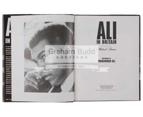 Muhammad Ali signed copy of "Ali in Britain" by Michael Tanner,signed on portrait photo before title page, personalised "To M