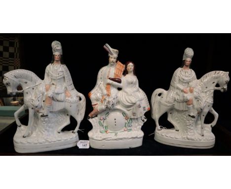 Pair of 19th Century Staffordshire pottery flat backed figurines of figures on horses, together with another clock face Staff