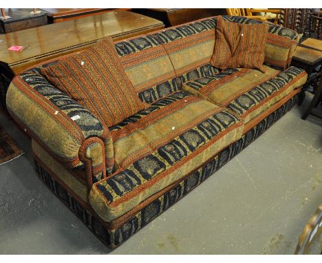 Large modern sofa with scrolled arms decorated with geometric designs and peacocks.(B.P. 21% + VAT) 