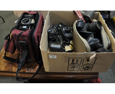 Collection of vintage cameras and other equipment to include; Canon T50, Canon T70, Canon Autozoom 318M etc, camera bags etc.