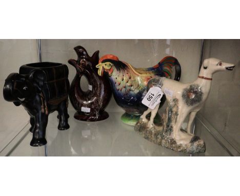 Novelty pottery teapot in the form of a cockerel, together with a Kernewek pottery glug jug and a ceramic elephant planter an