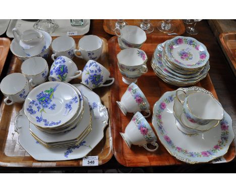 Two trays of part teaware, one tray of Royal Stafford fine bone china decorated with blue flowers and gilt edges (six teacups