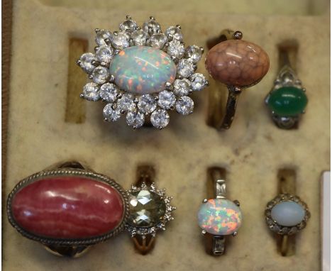 Collection of rings to include; two 9ct gold gemset rings, silver simulated opal rings etc. (7)(B.P. 21% + VAT)