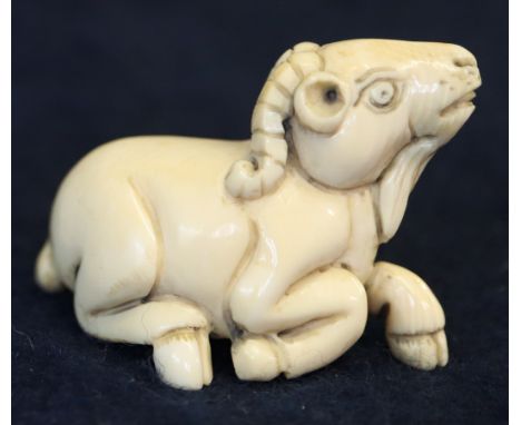 Japanese ivory netsuke of a stylised recumbent ram with signature to the base. (B.P. 21% + VAT) 
