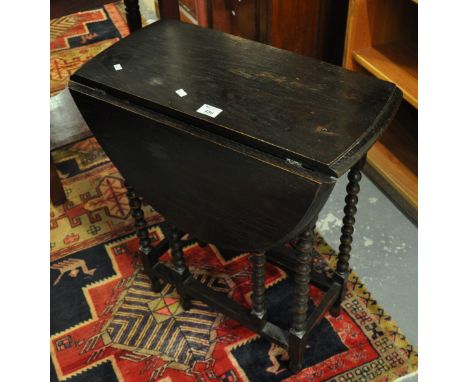 Early 20th Century stained oak gate legged table with bobbin turned supports. (B.P. 21% + VAT)