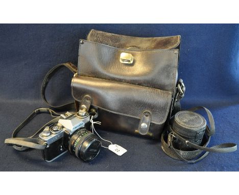 Minolta XD7 35mm camera in Minolta leather bag and Minolta teleconverter lens. (B.P. 21% + VAT) 