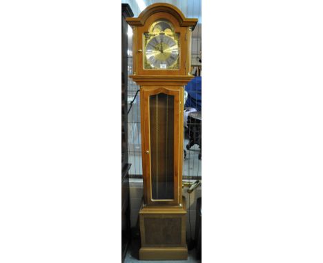 Reproduction yew wood longcase clock having moon face with silvered dial and brass mounts with three weights. Marked Richard 