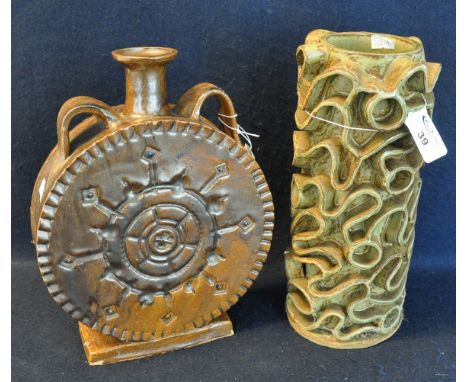 Mid Century art pottery two handled flask shaped vase, together with another art pottery vase with moulded swirl decoration. 