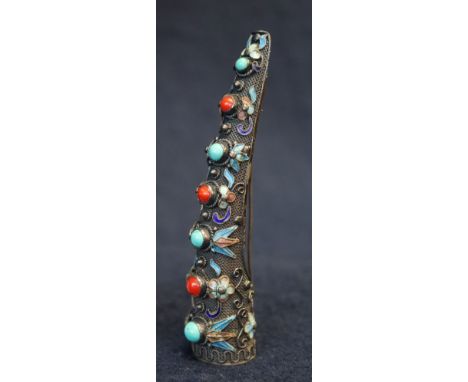 Unusual white metal brooch in the form of a tusk with enamel and semi-precious stone decoration.(B.P. 21% + VAT) 