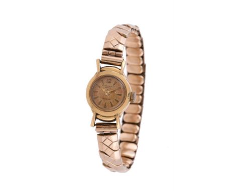 
	
		Baume &amp; Mercier, 
		Lady's gold bracelet watch, no. 133831 36129
		Movement: Manual wind, 17 jewels
		Case: Gold col