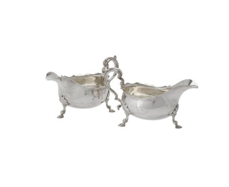 
	
		A pair of late Victorian silver shaped oval sauce boats by Thomas Bradbury &amp; Sons, London 1896, with double scroll h