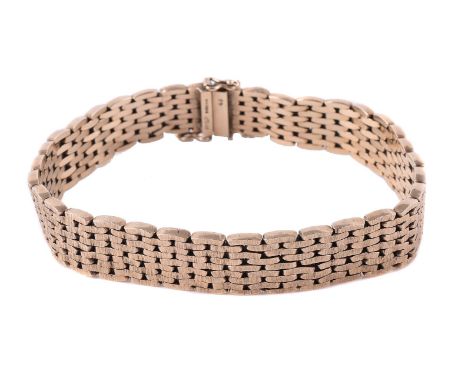 
	
		A 1960s 9 carat gold textured link bracelet, the textured interlocking links to a sliding concealed clasp, London 1968 h
