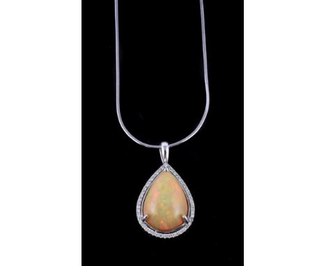 
	
		An opal and diamond pendant, the pear shaped cabochon opal within a three claw setting, within a surround of brilliant c