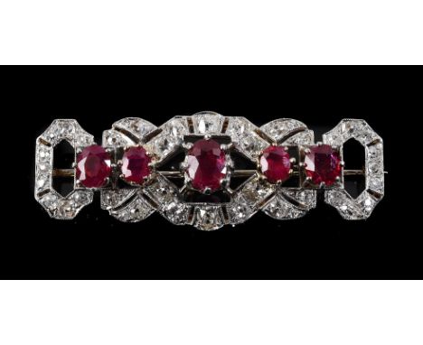 
	
		A mid 20th century ruby and diamond brooch, the pierced geometric old cut diamond set panel, approximately 1.22 carats t
