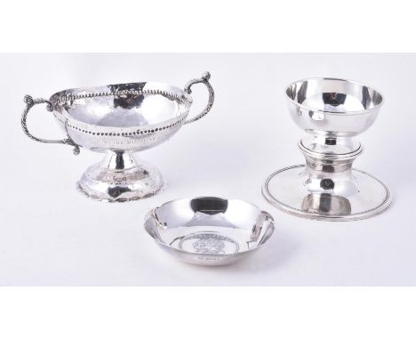 
	
		Four silver or silver coloured items, comprising: a twin handled oval pedestal bowl, unmarked, at least late 19th centur