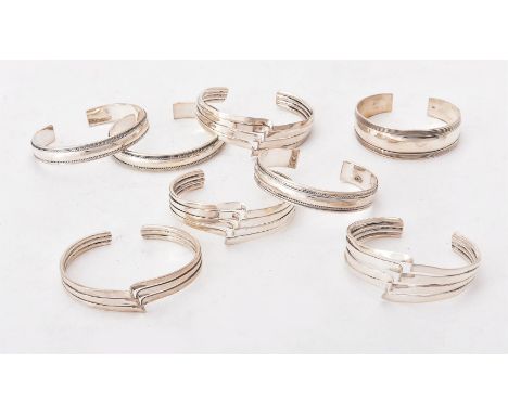 
	
		A collection of silver bangles, of various designs, with London hallmarks and stamped 925, approximately 864g (27.8ozt)
