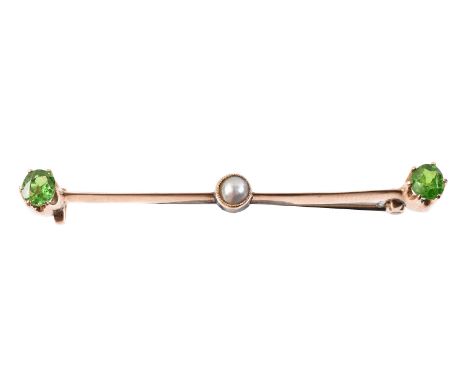 
	
		An Edwardian demantoid garnet and pearl bar brooch, the oval cut demantoids estimated to weigh 0.37 and 0.28 carats, on 