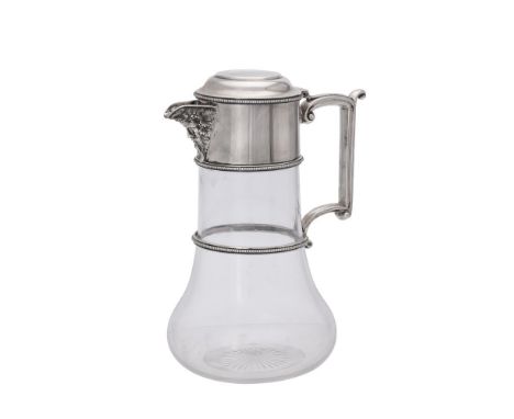 
	
		A late Victorian silver mounted clear glass claret jug by J. B. Carrington, Birmingham 1895, with a flat centre to the o