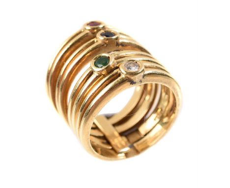 
	
		A multi gem set ring, the four interlocking bands each set with a single gem stone, comprising a brilliant cut diamond, 