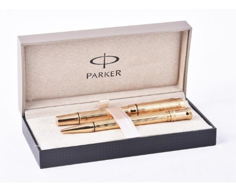 
	
		Parker, Duofold, a rare retail sample gilt metal fountain pen and ball point pen, the fountain pen cap with arrow clip, 
