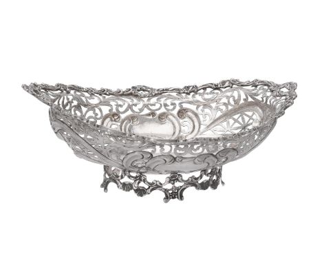 A continental silver coloured shaped oval pierced dish, stamped handmade 925, with a foliate and C-scroll border, pierced wit
