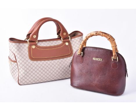 
	
		Celine, Boogie, a logo fabric and brown leather handbag, 33.5cm (13 1/4in) long; and Gucci, a small brown leather top ha