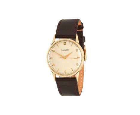 
	
		International Watch Co. (IWC), 
		Gold coloured wrist watch, no. 1183861, circa 1950
		Movement: Manual wind
		Case: Gol