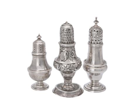 
	
		Three silver pepper casters, comprising: a George III ogee baluster and later embossed example by Hester Bateman, London