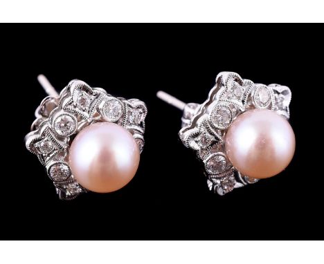 
	
		A pair of cultured pearl and diamond cluster earrings, the cultured pearls measuring 7mm diameter, within a pierced mill