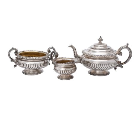 
	
		Y&nbsp;A George IV silver three piece circular tea set by S. C. Younge &amp; Co., Sheffield 1821, with a bell shaped fin