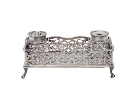 
	
		A silver rectangular ink stand by Robert Frederick Fox, London 1911, with a gadrooned border, pierced with foliate swags