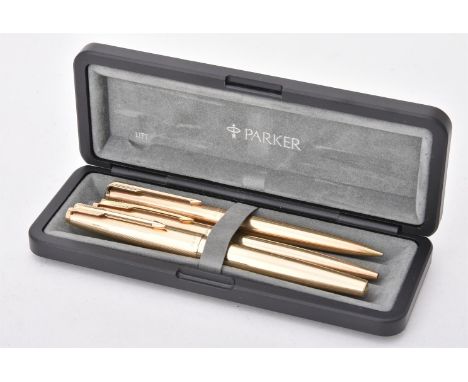 
	
		Parker, 61 Custom Insignia, a gold plated fountain pen, ballpoint pen and propelling pencil, the fountain pen cap with a