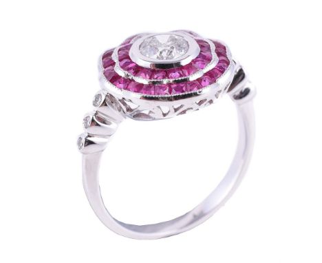 
	
		A ruby and diamond cluster ring, the central brilliant cut diamond in a collet setting, estimated to weigh 0.50 carats, 