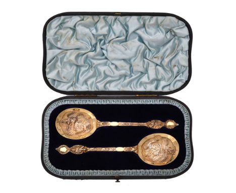 
	
		A cased pair of Victorian silver gilt spoons by Robert Stebbings, London 1892, chased with fairies and pixies, 19.5cm (7