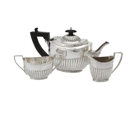 
	
		A Victorian silver oval half lobed three piece tea set by W. &amp; G. Sissons, London 1889 (1) and 1890 (2), the tea pot