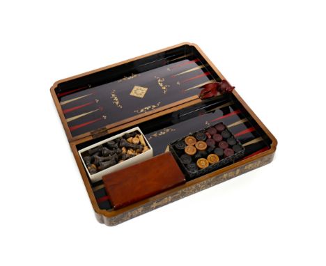 EARLY 20TH CENTURY JAPANNED GAMES BOARD, formed with two hinged section richly painted and lacquered in gilt on black, a cheq