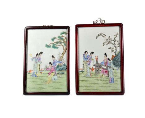PAIR OF 20TH CENTURY CHINESE CERAMIC POLYCHROME PLAQUES, of rectangular form, painted with female figures in garden settings,