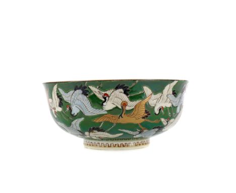 JAPANESE BOWL, Meiji period, of circular form, painted with cranes in flight in gilt, blue and white enamel on a green ground