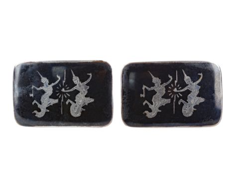 TWO SIAMESE SILVER AND ENAMEL BUCKLES, decorated with dancers, each 5cm x 3cm Provenance: A Private Scottish Collection