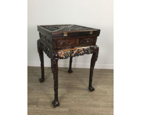 CHINESE ENVELOPE CARD TABLE, the square top formed with four hinged triangular flaps, each carved in relief with fruiting vin