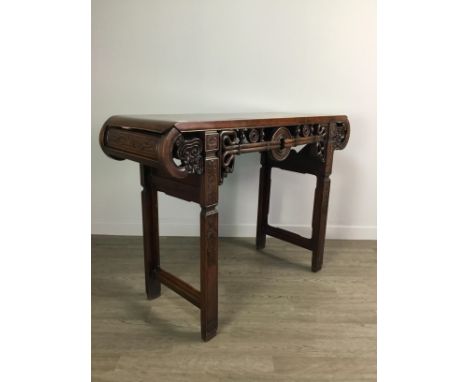 CHINESE MAHOGANY ALTAR TABLE, the rectangular top with scroll ends, the frieze pierced with a symmetric design to each side, 