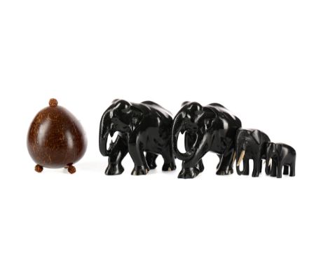 PAIR OF AFRICAN EBONISED ELEPHANTS, 13cm high, along with two smaller ebonised elephants and a coconut shell caddy with detac