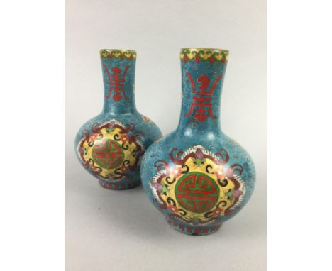 PAIR OF 20TH CENTURY CHINESE CLOISONNE ENAMEL VASES, decorated with symbols and bats on a field of clouds and on a blue groun