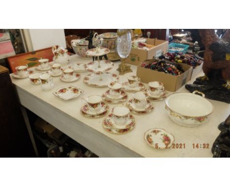 A Royal Albert tea set, thirty-three pieces inc. teapot, sugar bowl, cake stand and milk jug etc.