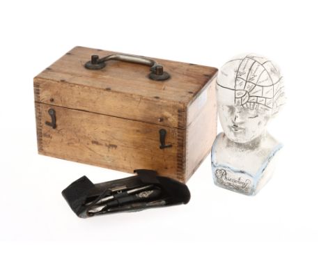 A Collected Field Surgeon Set, including folding knives, a fleam, thermometer, etc., and a small phrenology head (a lot)