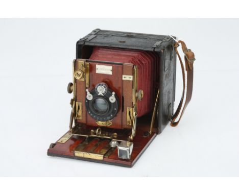 A Sanderson Popular Model Quarter Plate Hand &amp; Stand Camera, black with red bellows, body G, bellows G, with unmarked len