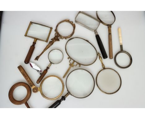 A Collection of 12 Magnifying Glasses, decorative and vintage, including example in Art Nouveau style, one with bone handle, 