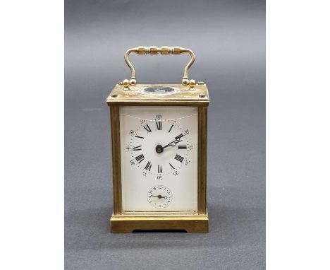 An antique brass carriage clock, with alarm, height including handle 14cm, (alarm faulty), with winding key. 